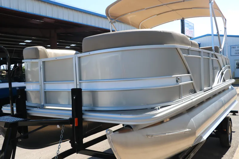 Slide: The Image of 2025 Sylvan Mirage 820 CLZ DH pontoon boat with canopy on trailer. - 7