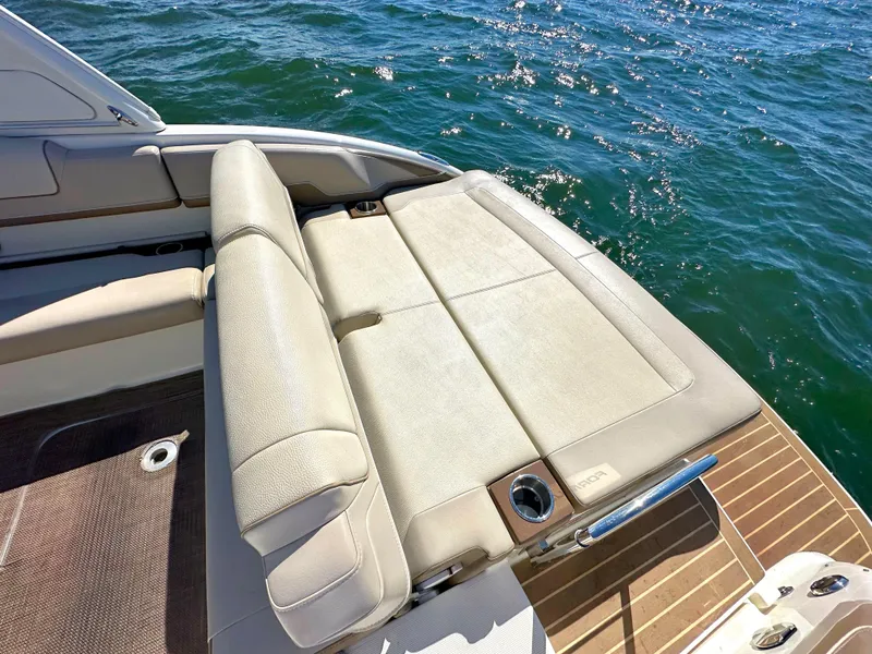 Slide: The Image of 2015 Formula 310 Sun Sport boat with sun pad and seating area. - 12
