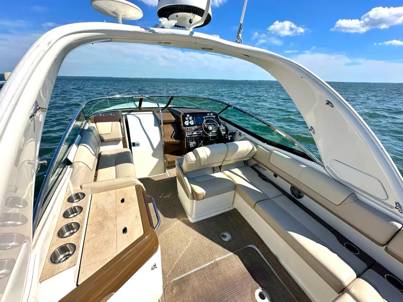 Slide: The Image of 2015 Formula 310 Sun Sport boat interior with luxurious seating and ocean view. - 13