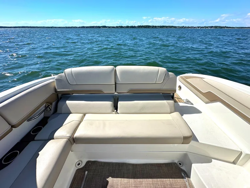 Slide: The Image of 2015 Formula 310 Sun Sport boat with spacious seating on open water. - 15