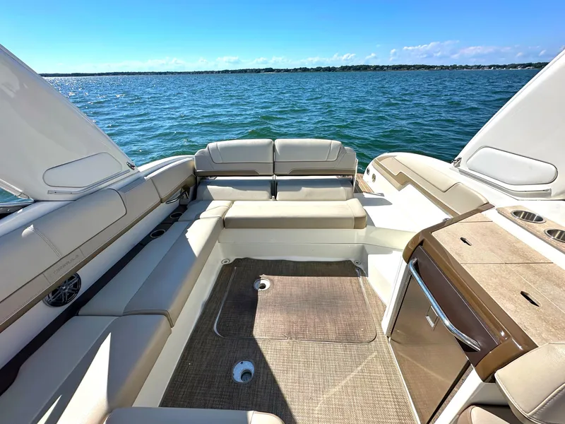 Slide: The Image of 2015 Formula 310 Sun Sport boat interior with seating, on a sunny day. - 16