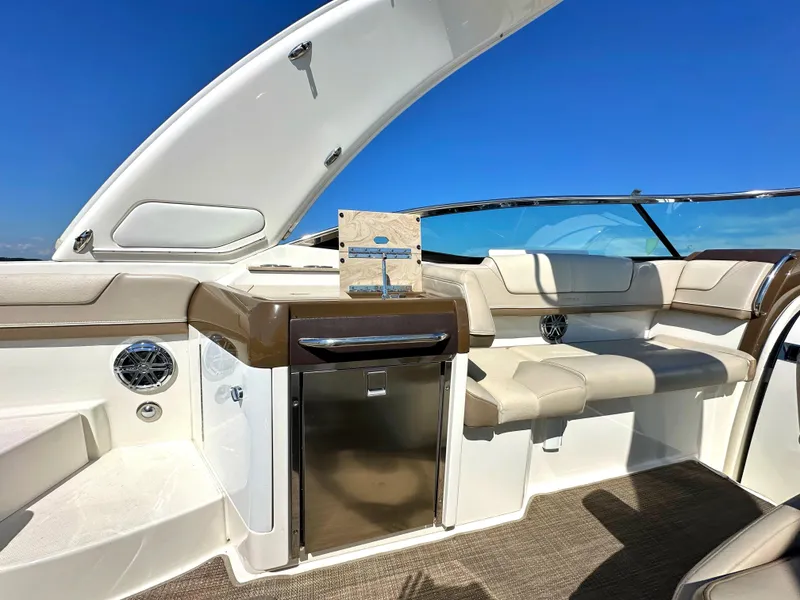 Slide: The Image of 2015 Formula 310 Sun Sport boat interior with seating and mini fridge. - 18