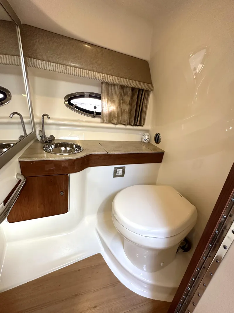 Slide: The Image of 2015 Formula 310 Sun Sport boat bathroom with sink and toilet. - 31