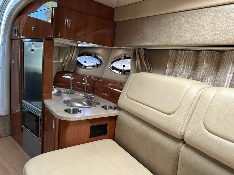 Slide: The Image of 2015 Formula 310 Sun Sport interior with kitchenette and seating area. - 33
