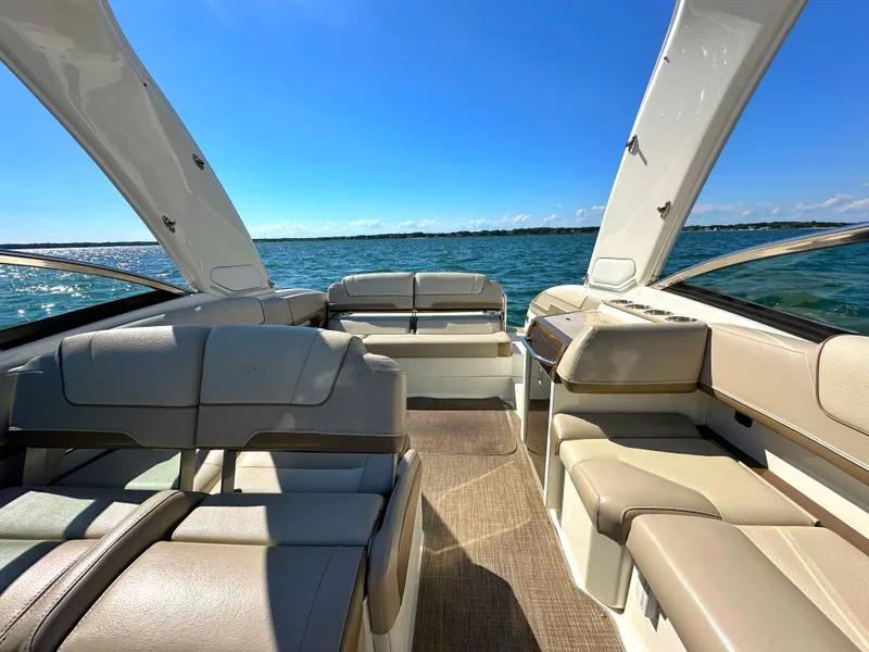 Slide: The Image of 2015 Formula 310 Sun Sport boat interior with luxurious seating on open water. - 34