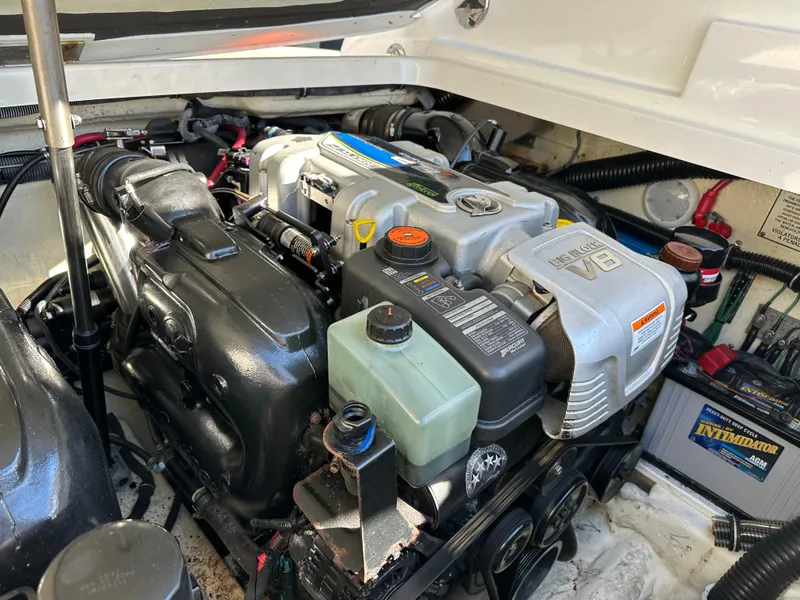 Slide: The Image of 2015 Formula 310 Sun Sport engine compartment with V8 engine and battery. - 40