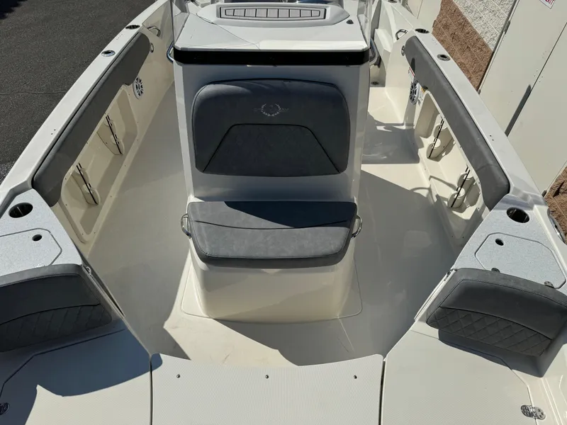 Slide: The Image of 2022 Stingray 206 CC boat interior with seating and console. - 12