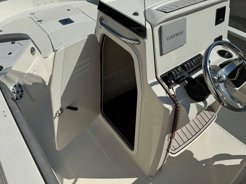 Slide: The Image of 2022 Stingray 206 CC boat console with Garmin navigation system. - 16