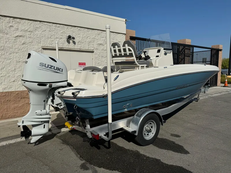 Slide: The Image of 2022 Stingray 206 CC boat with 140 HP outboard motor on trailer. - 6