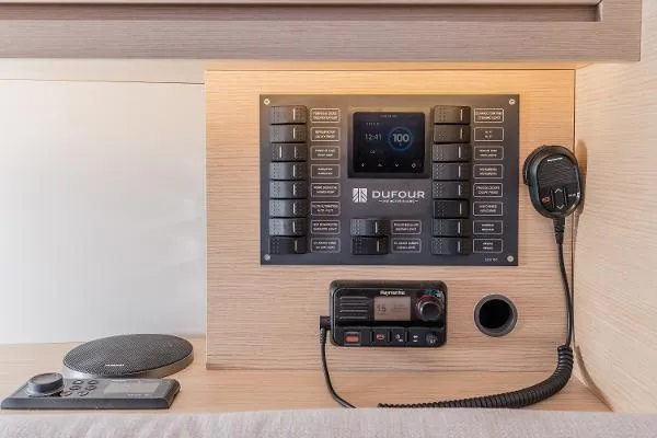 Slide: The Image of Control panel of 2024 Dufour 37 yacht with communication equipment and navigation controls. - 5