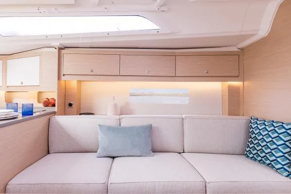 Slide: The Image of Interior of 2024 Dufour 37 yacht with modern beige sofa and stylish decor. - 6