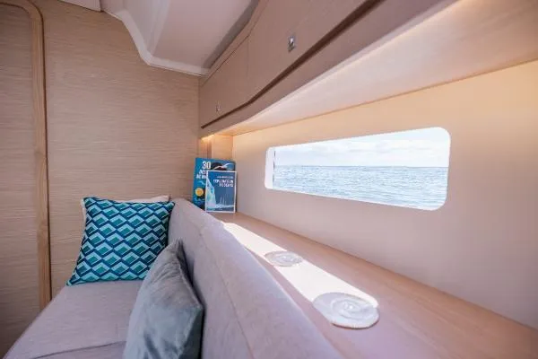 Slide: The Image of Interior of 2024 Dufour 37 yacht with ocean view through window. - 7
