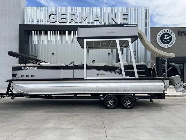 Slide: The Image of 2018 Avalon Catalina Funship 27' pontoon boat with slide on trailer at Germaine dealership. - 1