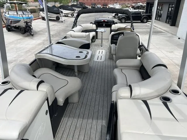 Slide: The Image of 2018 Avalon Catalina Funship 27' pontoon boat interior with luxurious seating and table. - 10