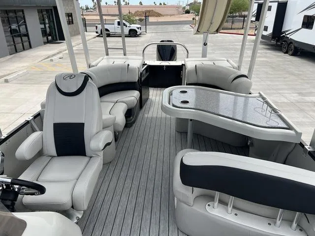 Slide: The Image of 2018 Avalon Catalina Funship 27' pontoon boat interior with seating and table. - 11