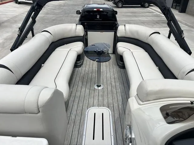 Slide: The Image of 2018 Avalon Catalina Funship 27' interior with plush seating and table. - 12