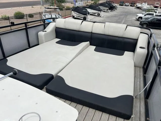 Slide: The Image of 2018 Avalon Catalina Funship 27' upper deck lounge area with cushioned seating. - 14