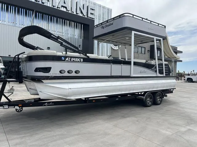 Slide: The Image of 2018 Avalon Catalina Funship 27' pontoon boat on a trailer. - 2