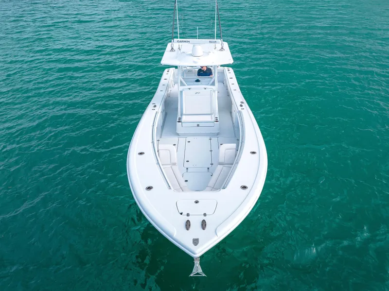 Slide: The Image of 2023 Yellowfin 36 boat on clear turquoise water. - 15