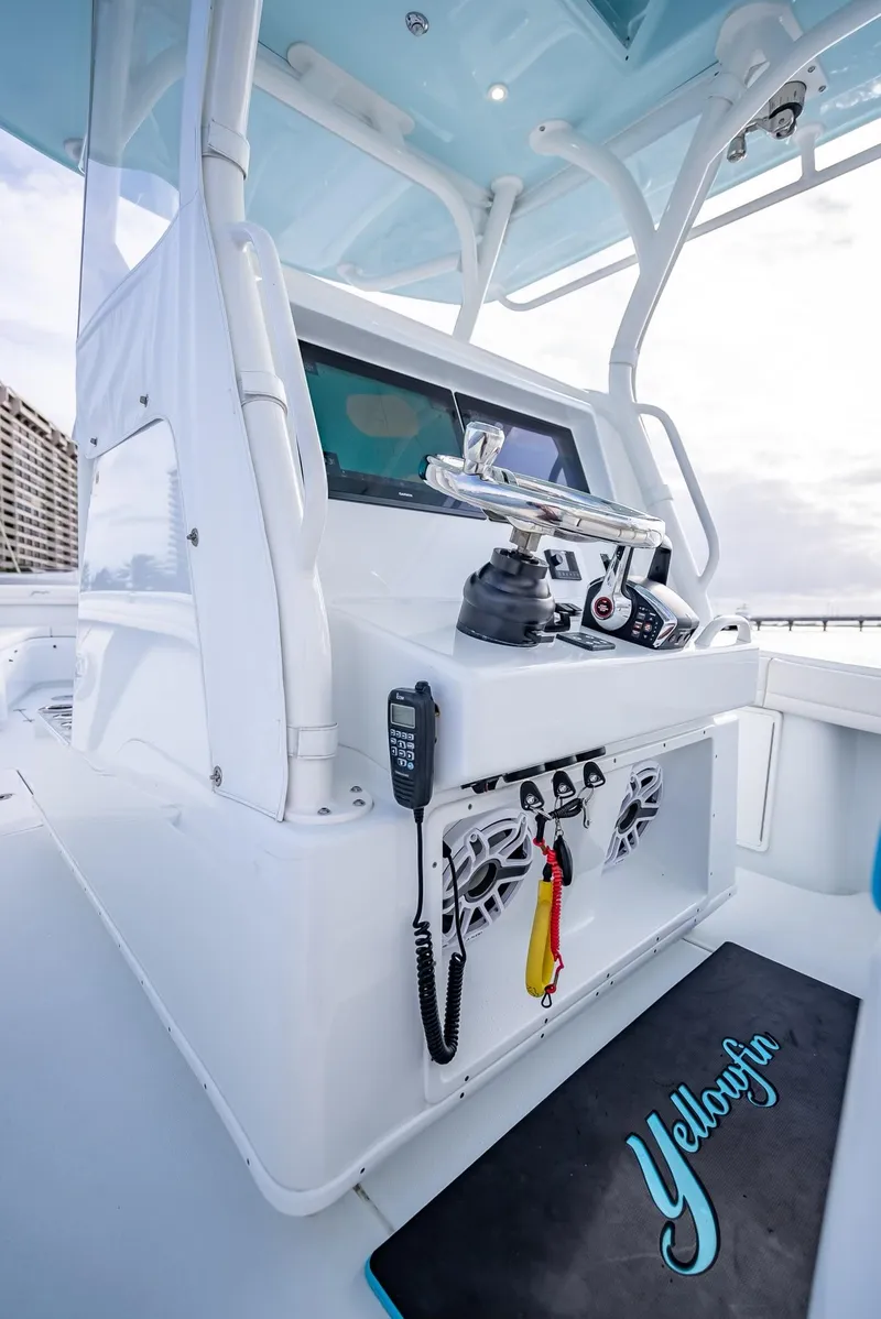 Slide: The Image of Yellowfin 36 boat console, 2023 model, featuring advanced navigation and communication equipment. - 24