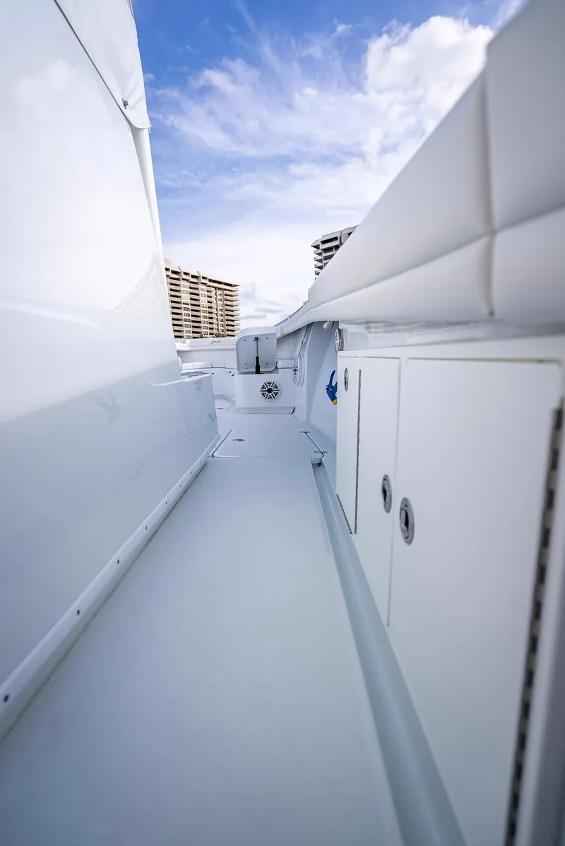Slide: The Image of 2023 Yellowfin 36 boat deck with storage compartments and clear sky. - 47