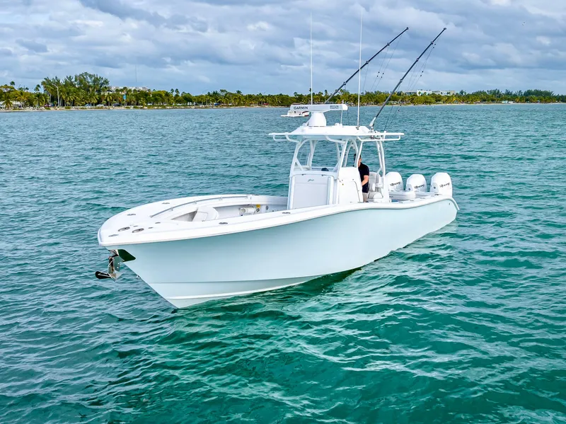 Slide: The Image of 2023 Yellowfin 36 boat on open water with fishing rods. - 9