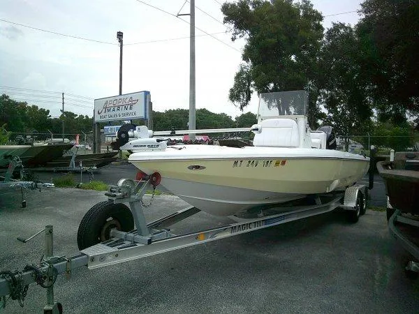 Slide: The Image of 2015 Velocity 220 Bay boat on a trailer at a marine service center. - 10