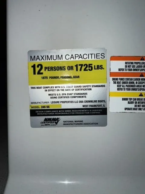 Slide: The Image of Maximum capacities label on a 2011 Crownline BOWRIDER 245 SS boat. - 10