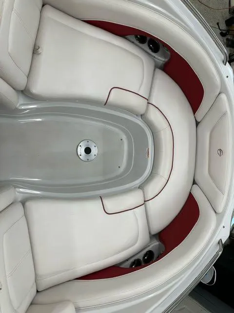 Slide: The Image of 2011 Crownline BOWRIDER 245 SS boat interior with white and red seating. - 12
