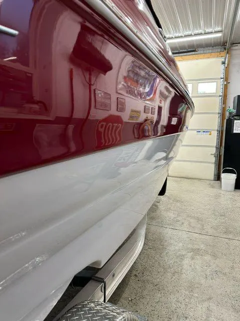 Slide: The Image of 2011 Crownline BOWRIDER 245 SS in a garage, close-up side view. - 2