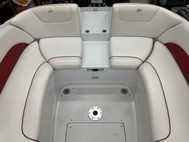 Slide: The Image of 2011 Crownline BOWRIDER 245 SS interior seating area with white and red upholstery. - 8