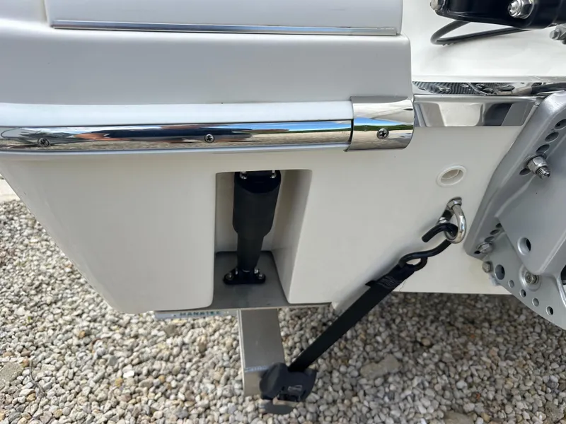 Slide: The Image of Close-up of 2023 Blackwood 27HD boat's rear section with chrome detailing. - 15