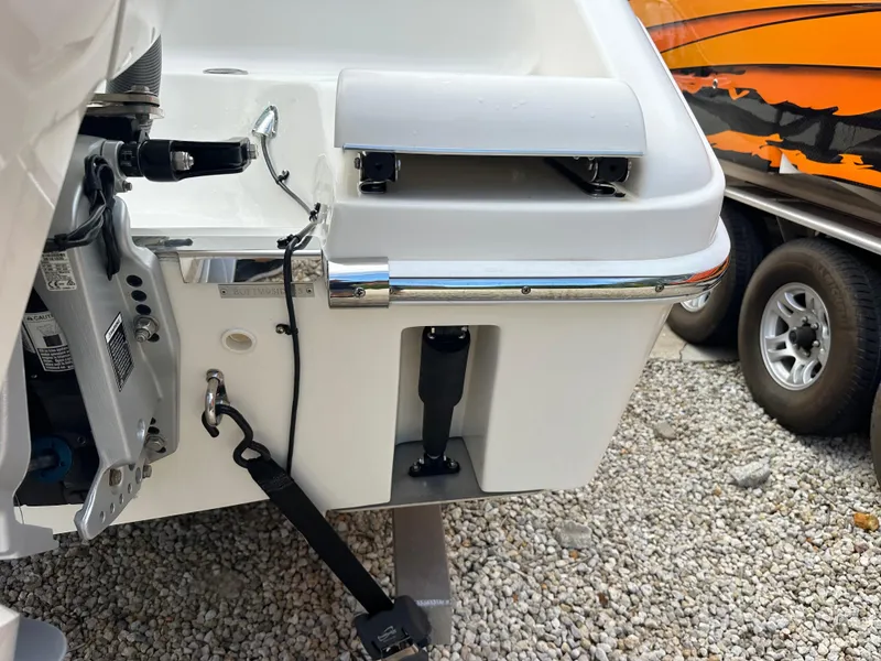 Slide: The Image of 2023 Blackwood 27HD boat stern detail with motor mount and trailer. - 17