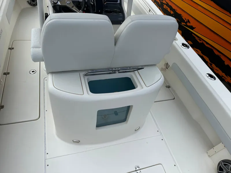 Slide: The Image of 2023 Blackwood 27HD boat interior with white seating and storage compartment. - 20