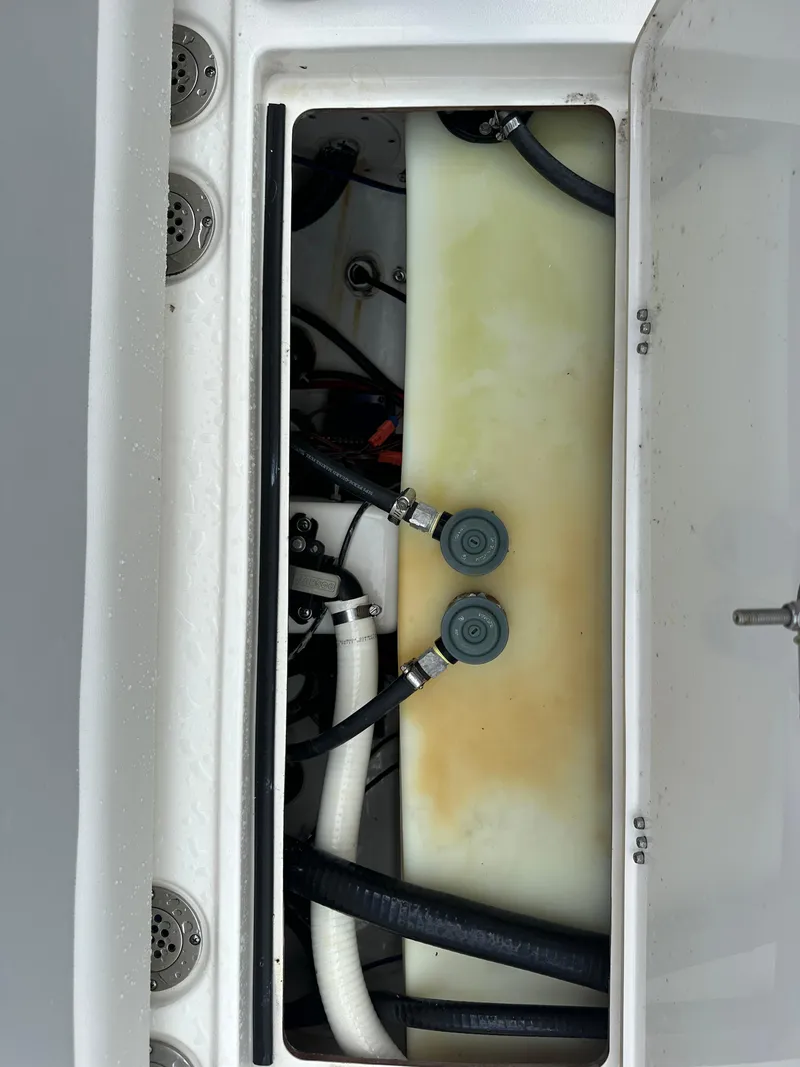 Slide: The Image of 2023 Blackwood 27HD boat compartment with hoses and connectors. - 21