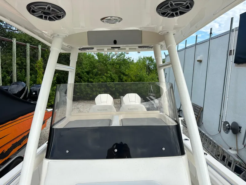 Slide: The Image of 2023 Blackwood 27HD boat interior with dual seats and overhead speakers. - 28