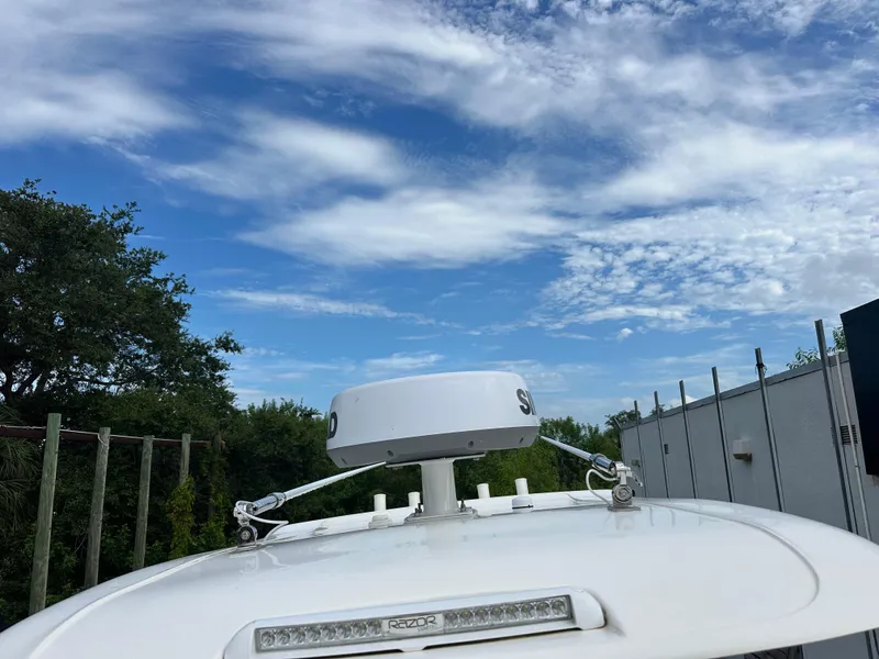 Slide: The Image of 2023 Blackwood 27HD boat roof with radar against a blue sky. - 29