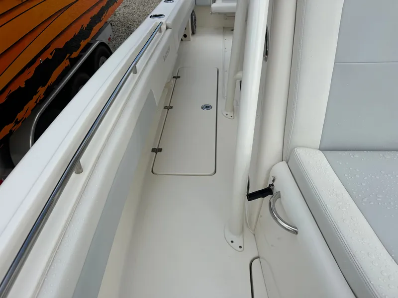 Slide: The Image of 2023 Blackwood 27HD boat interior with white seating and sleek design. - 30