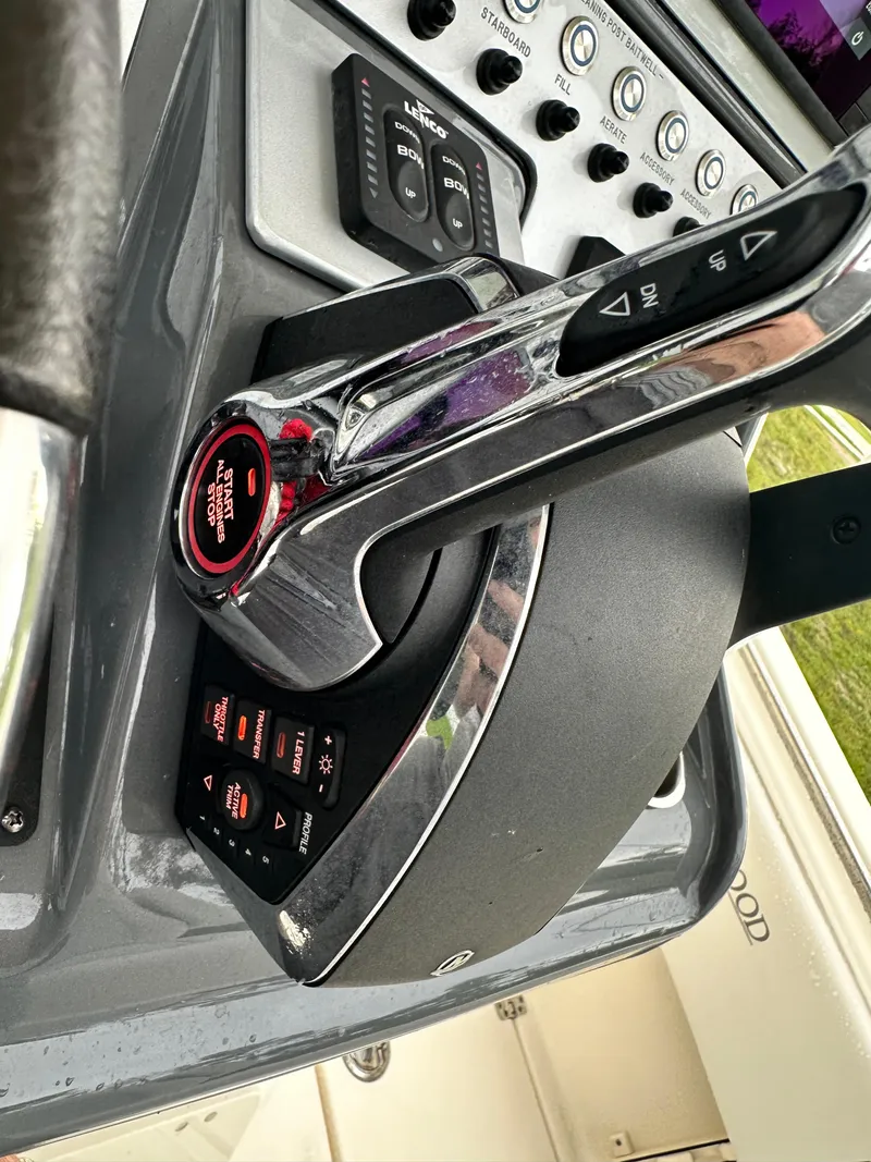 Slide: The Image of 2023 Blackwood 27HD boat throttle control and dashboard. - 4
