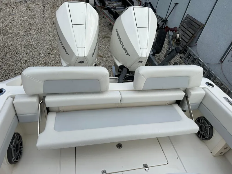 Slide: The Image of 2023 Blackwood 27HD boat with dual Mercury engines and cushioned seating. - 42