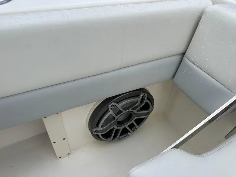 Slide: The Image of Blackwood 27HD 2023 boat interior with speaker and cushioned seating. - 43