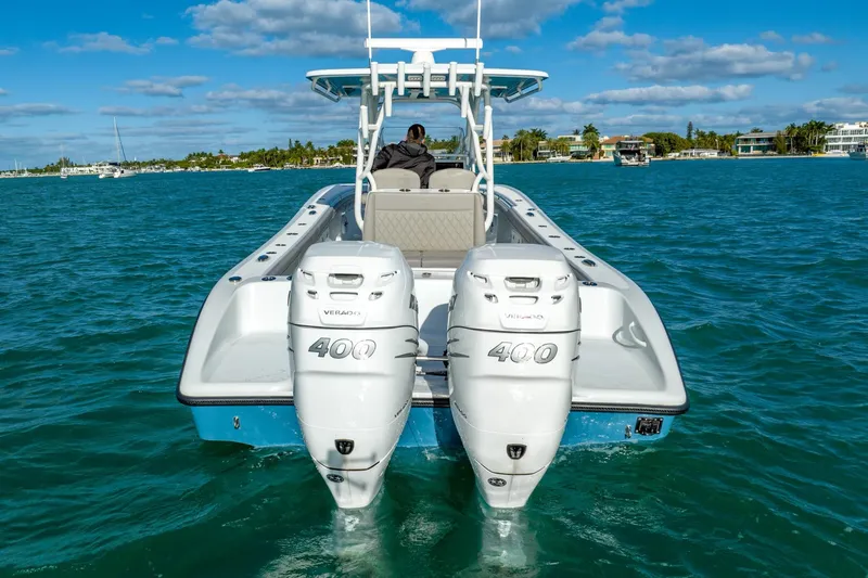 Slide: The Image of 2025 Yellowfin 32 boat with twin 400 horsepower engines on the water. - 10