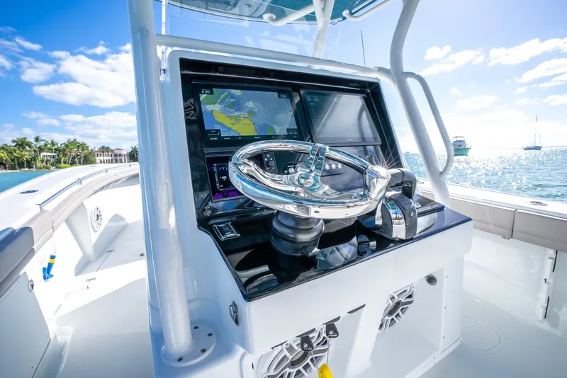 Slide: The Image of 2025 Yellowfin 32 boat helm with advanced navigation system. - 18