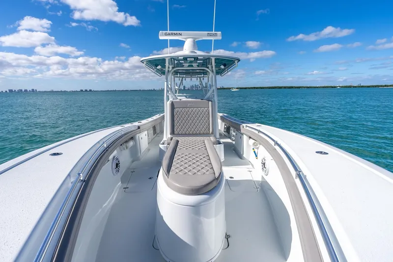 Slide: The Image of 2025 Yellowfin 32 boat on open water with clear blue sky. - 23