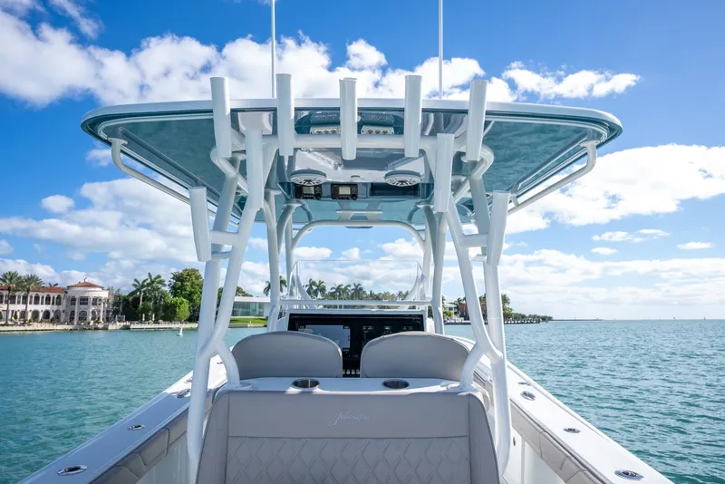 Slide: The Image of 2025 Yellowfin 32 boat on calm waters with clear blue sky. - 29