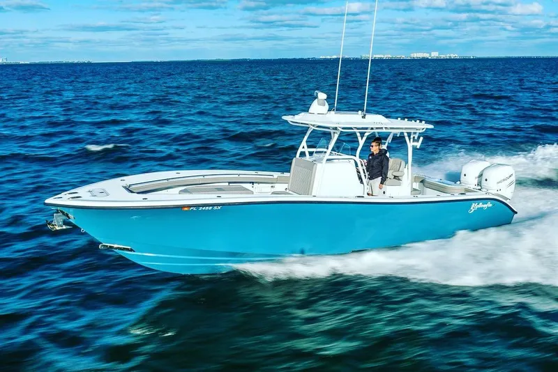 Slide: The Image of 2025 Yellowfin 32 boat cruising on open water. - 3