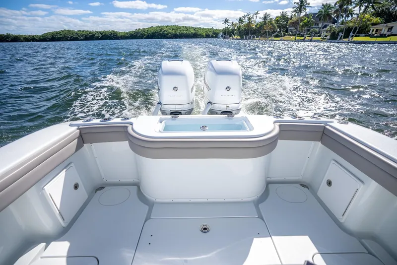 Slide: The Image of 2025 Yellowfin 32 boat with twin outboard engines on the water. - 32