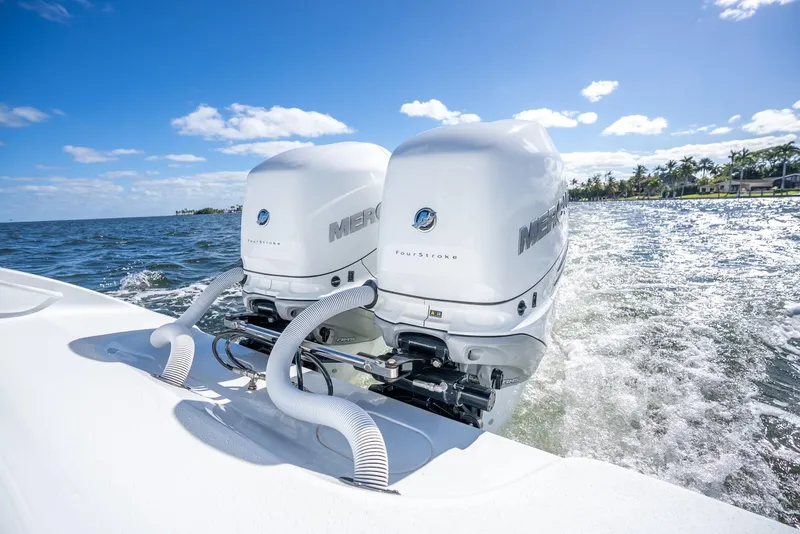 Slide: The Image of 2025 Yellowfin 32 boat with twin Mercury outboard engines on the water. - 33