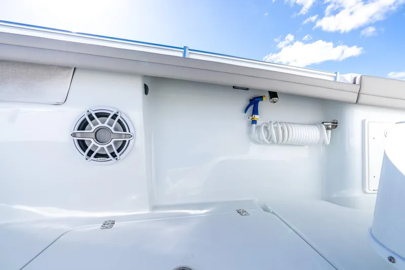 Slide: The Image of 2025 Yellowfin 32 boat deck with speaker and hose. - 35