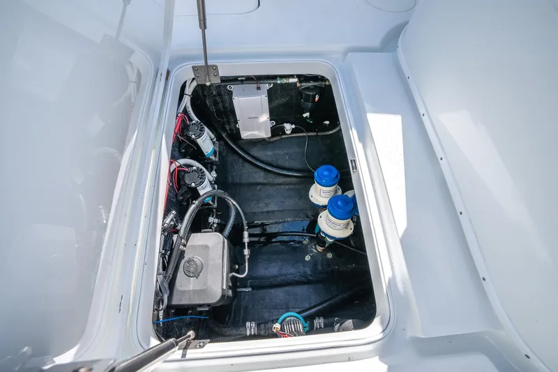 Slide: The Image of Engine compartment of a 2025 Yellowfin 32 boat with visible components and wiring. - 44